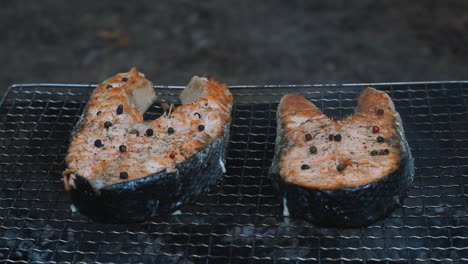 Grilling-salmon-steak-on-hot-grill.-Closeup-salmon-fillet-cooking-on-grill