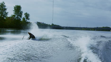 Rider-falling-from-wakeboard-into-river.-Sportsman-failing.-Fall-on-water
