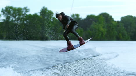 Wake-board-rider-jumping-high-over-water.Wake-surfing-rider-on-water