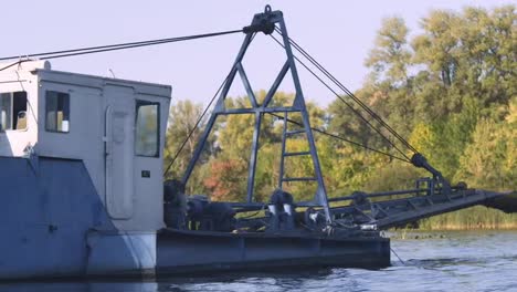 Industrial-barge-float-on-river-in-slow-motion.-Industrial-vessel.-Water-cargo