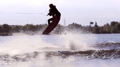Man-making-extreme-jump-on-wakeboarding-in-slow-motion.-Extreme-water-sports