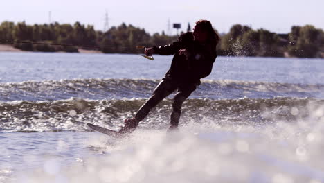 Wake-boarding-rider-enjoy-training.-Surfer-making-trick-on-wakeboard