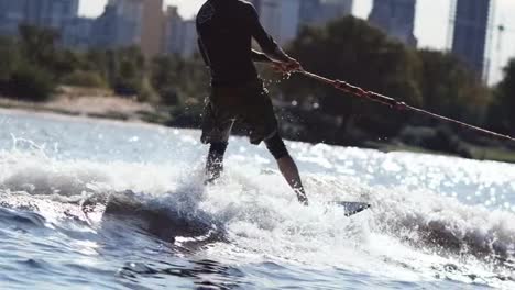 Extreme-sportsman-riding-water.-Wake-boarding-sport.-Summer-adrenaline