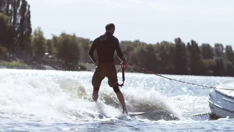 Rider-wake-boarding-boat.-Sportsman-enjoy-summer-extreme