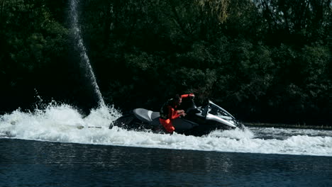 Sportsman-swirling-on-speedy-jet-ski-on-river.-Extreme-water-sport-concept