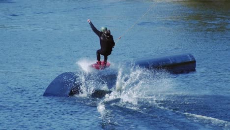 Wakeboarder-surfing-along-sportive-projectile-in-slow-motion.-Healthy-lifestyle