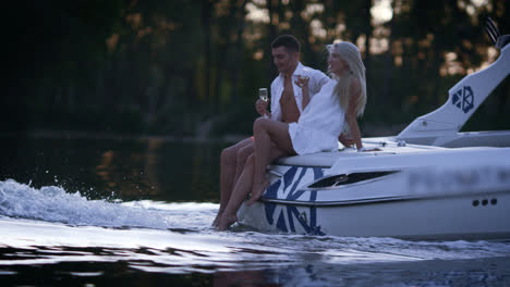 Lovely-charming-couple-relaxing-on-floating-boat.-Romantic-boating-on-river