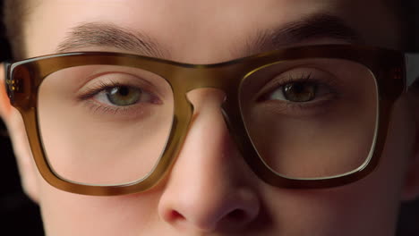 Macro-portrait-of-serious-businesswoman-wearing-glasses-for-working-in-office-.