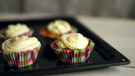 Cooking-cupcakes.-Hand-put-cup-cake-on-baking-tray.-Homemade-cupcakes