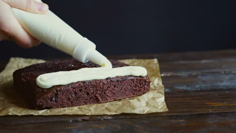 Chef-making-cake.-Chef-decorating-cake-with-pastry-bag.-Cream-cake
