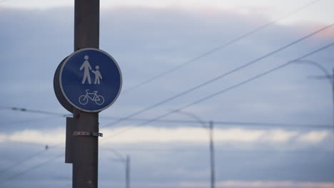 Bicycle-pedestrian-blue-road-sign-closeup.-City-traffic-control-plates-concept.